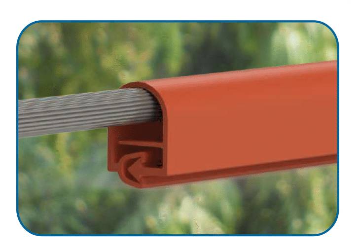 A bare stranded conductor entering the open end of a red extruded line cover, with the cover's locking seam closed along its underside